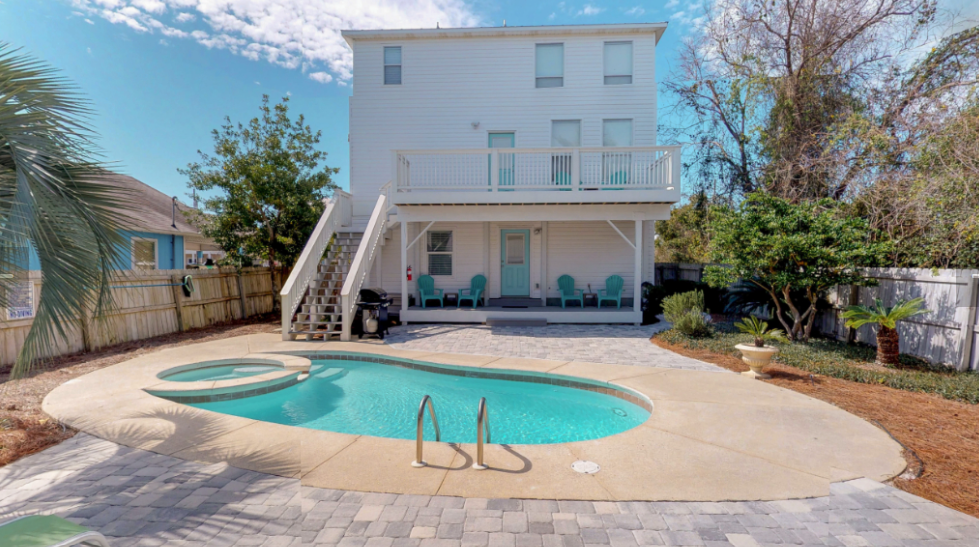 A modern house with a private pool in the backyard.
