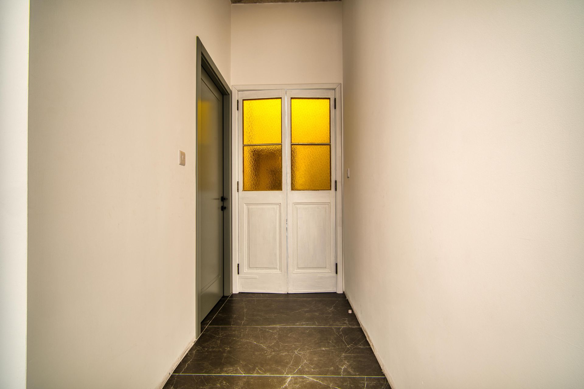 Corridor with stained glass doors