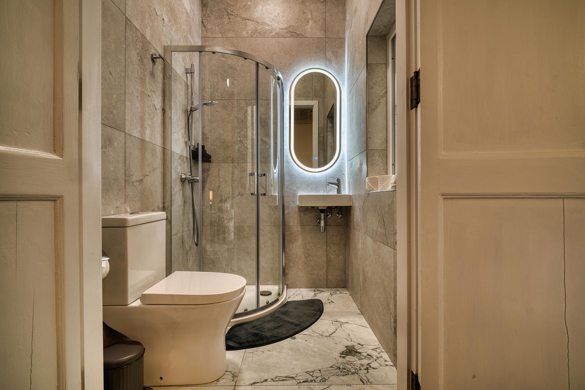 En-suite shower room with LED mirror