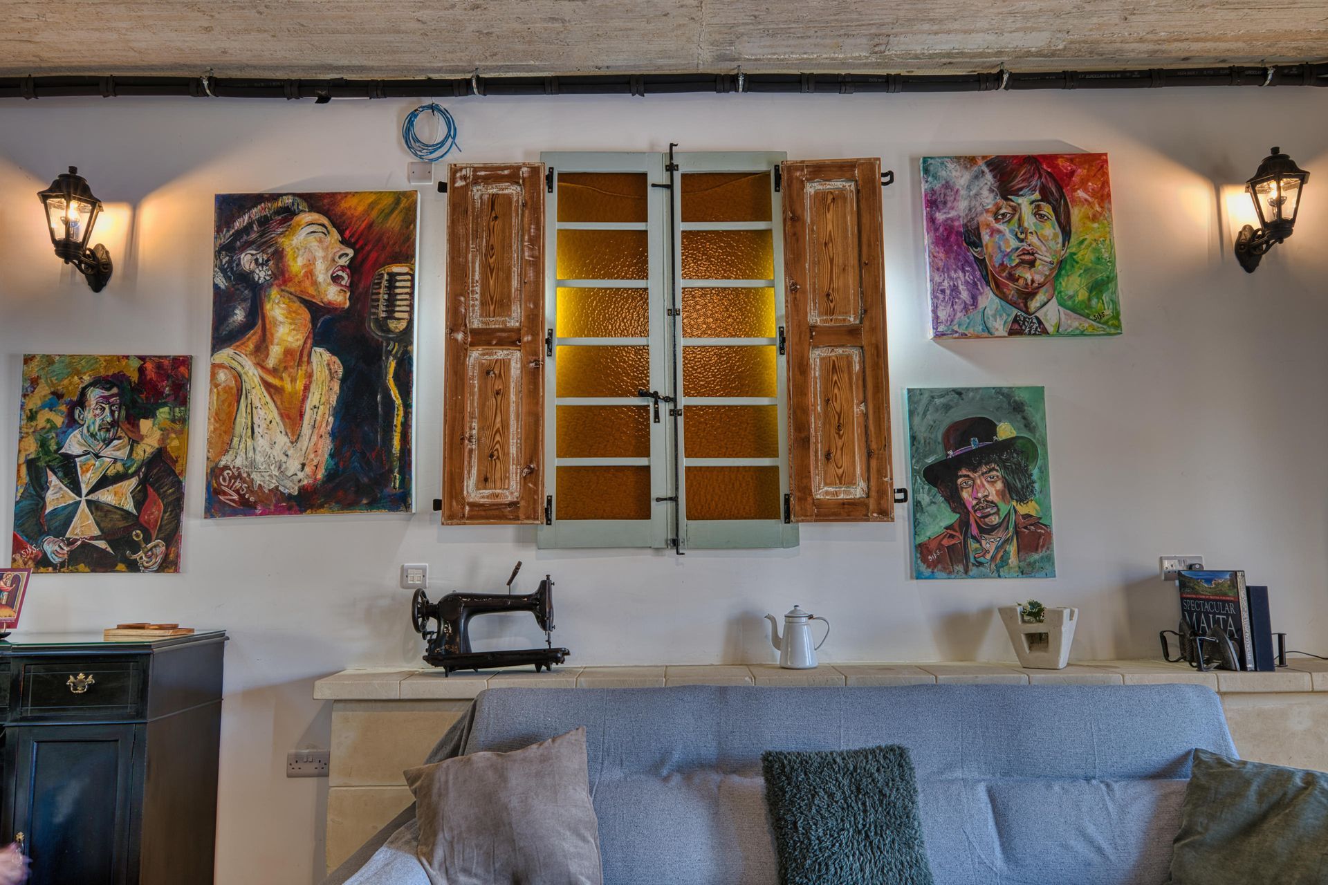 Living room art wall with antique wooden shutters
