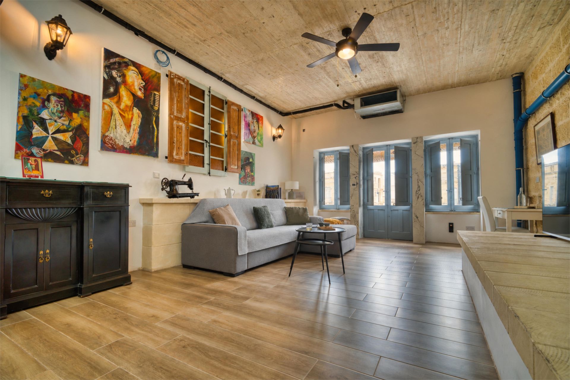 Living room with sofa and doors to the terrace