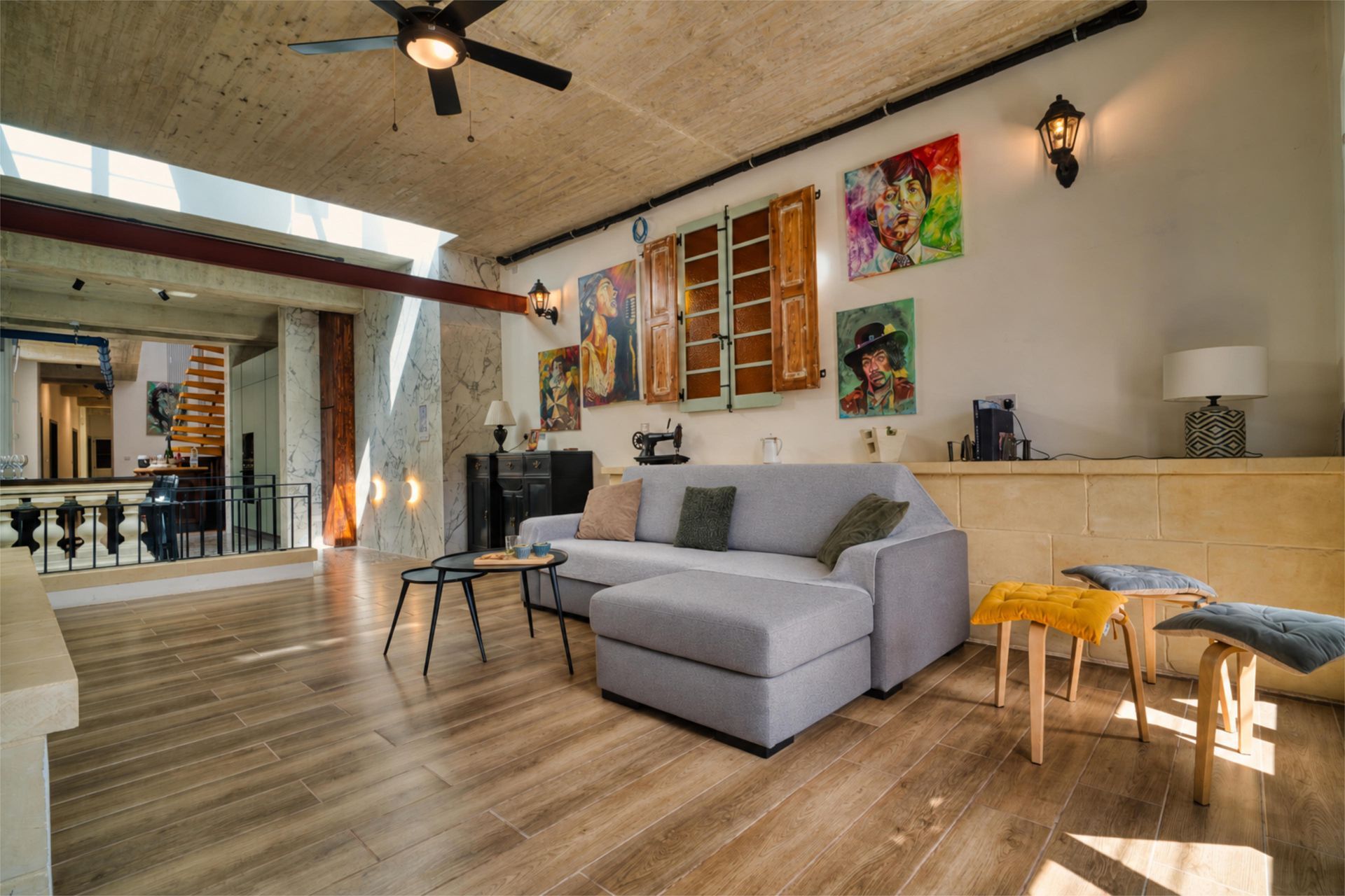 Bright living room with sofa opening onto the terrace