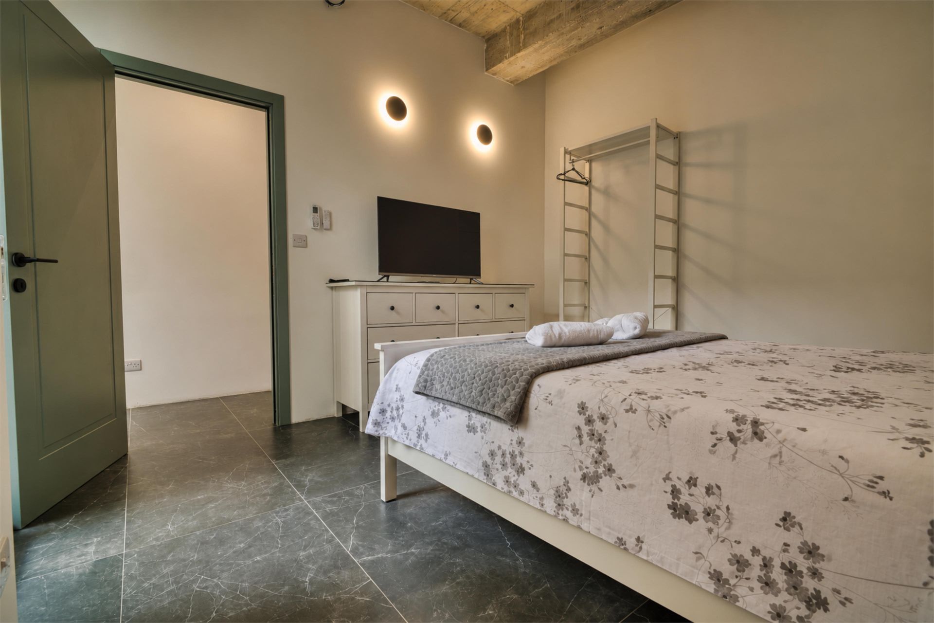 Main bedroom with TV and dresser