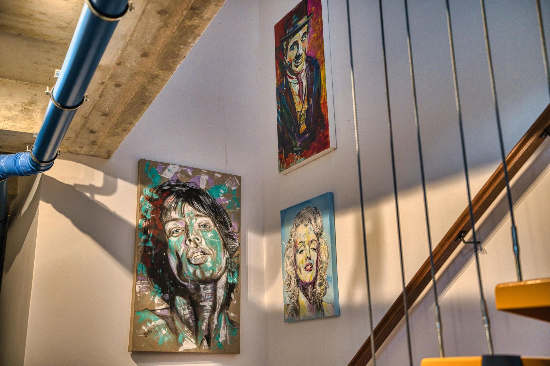 Pop art paintings by the staircase