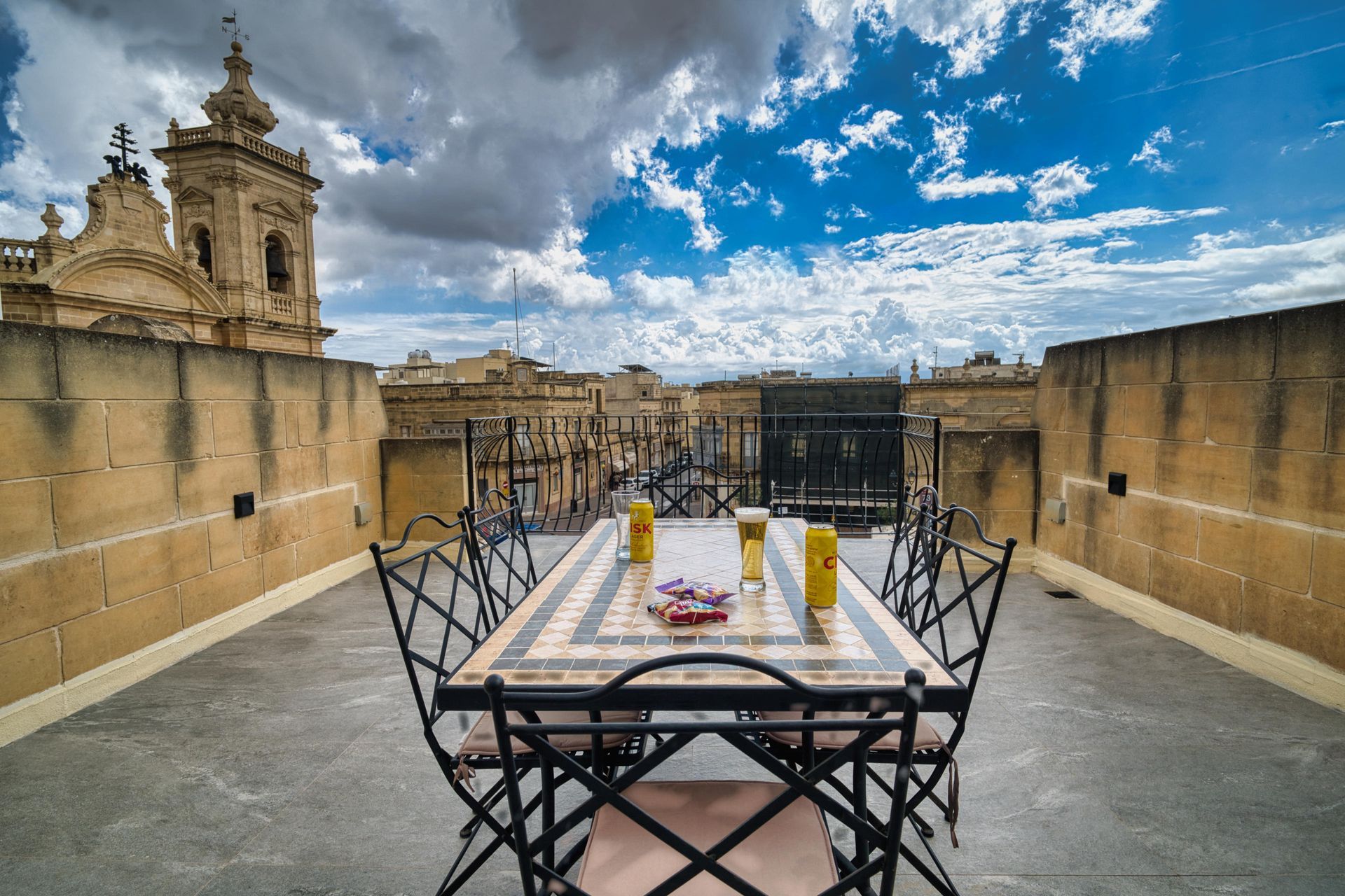 Mosaic dining table with the basilica beyond