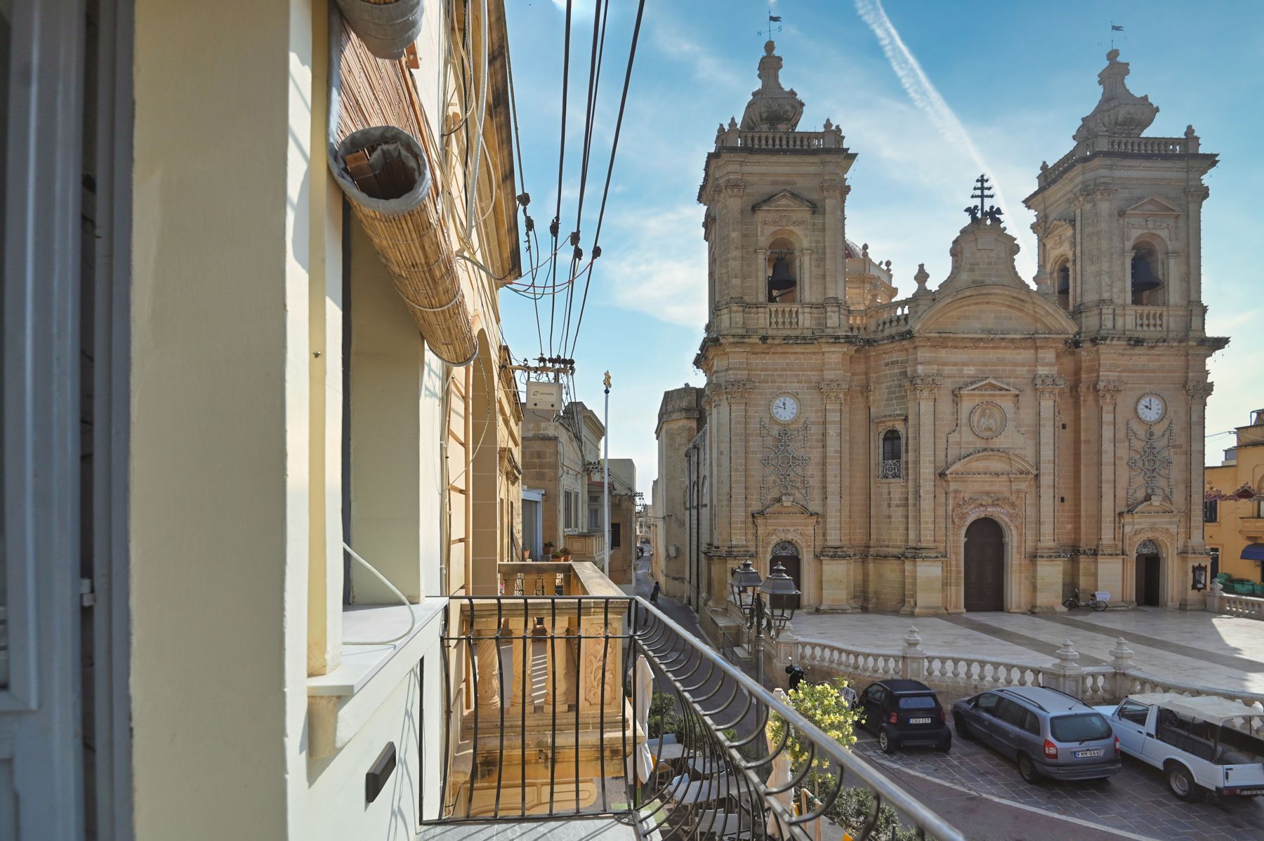 Balcony overlooking Xagħra square and the basilica