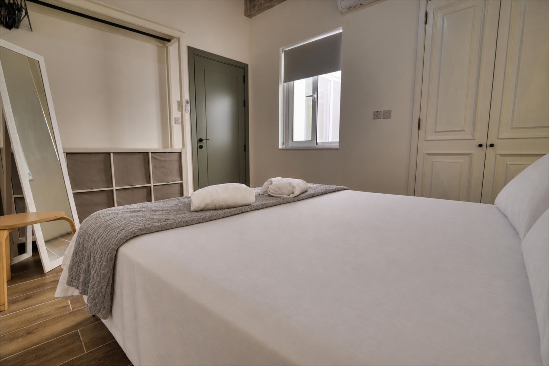 Second bedroom with mirror and wardrobe