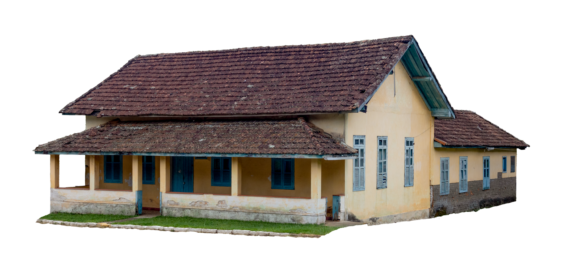 Une vieille maison jaune avec un toit de tuiles brunes.