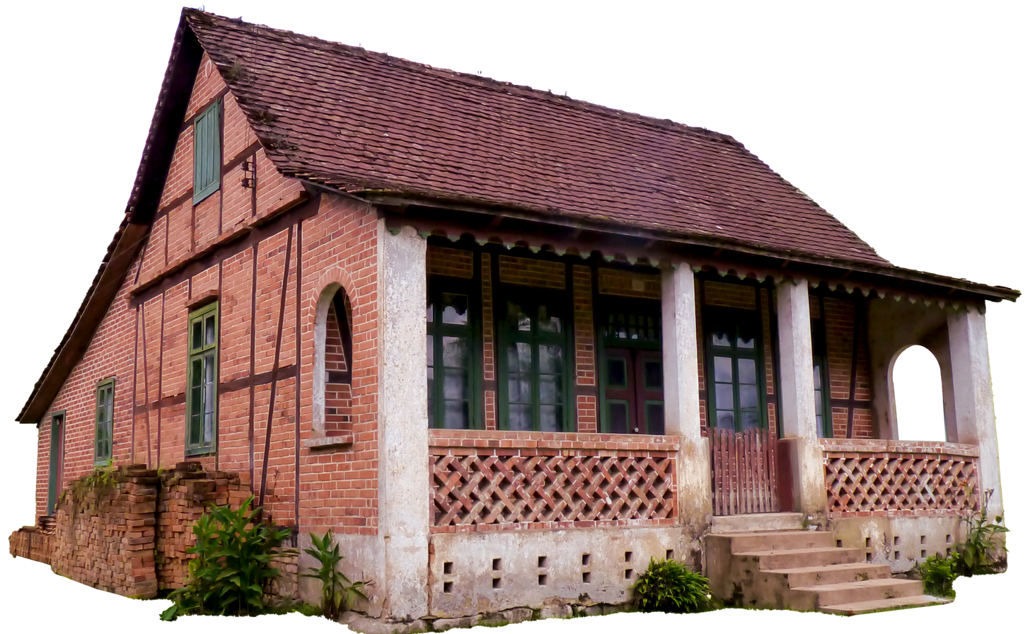 Maison en briques et à colombages avec un porche et un toit de tuiles rouges.