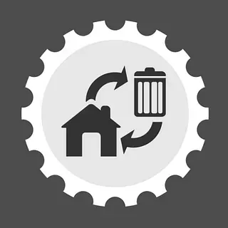 Un engranaje con una casa y un bote de basura dentro.