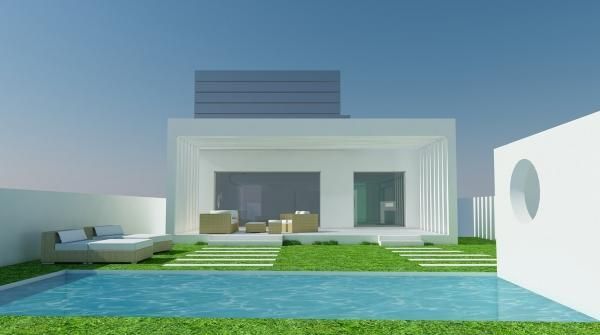 Una casa blanca con una piscina delante de ella.