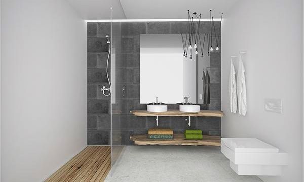 Un baño con dos lavabos y un espejo grande.