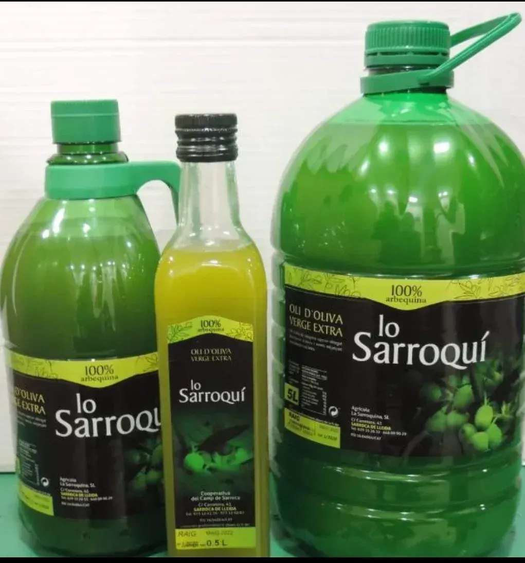 Tres botellas de aceite de oliva virgen extra Lo Sarroquí de distintos tamaños