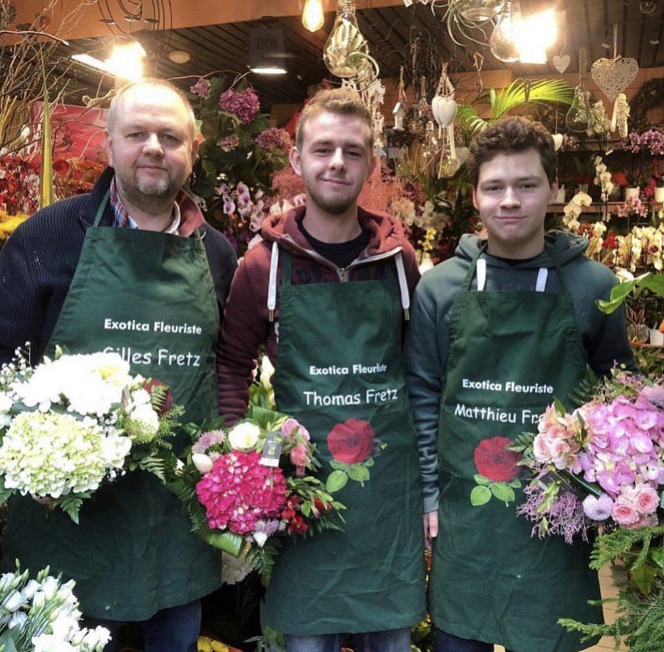 Trois fleuristes en tablier