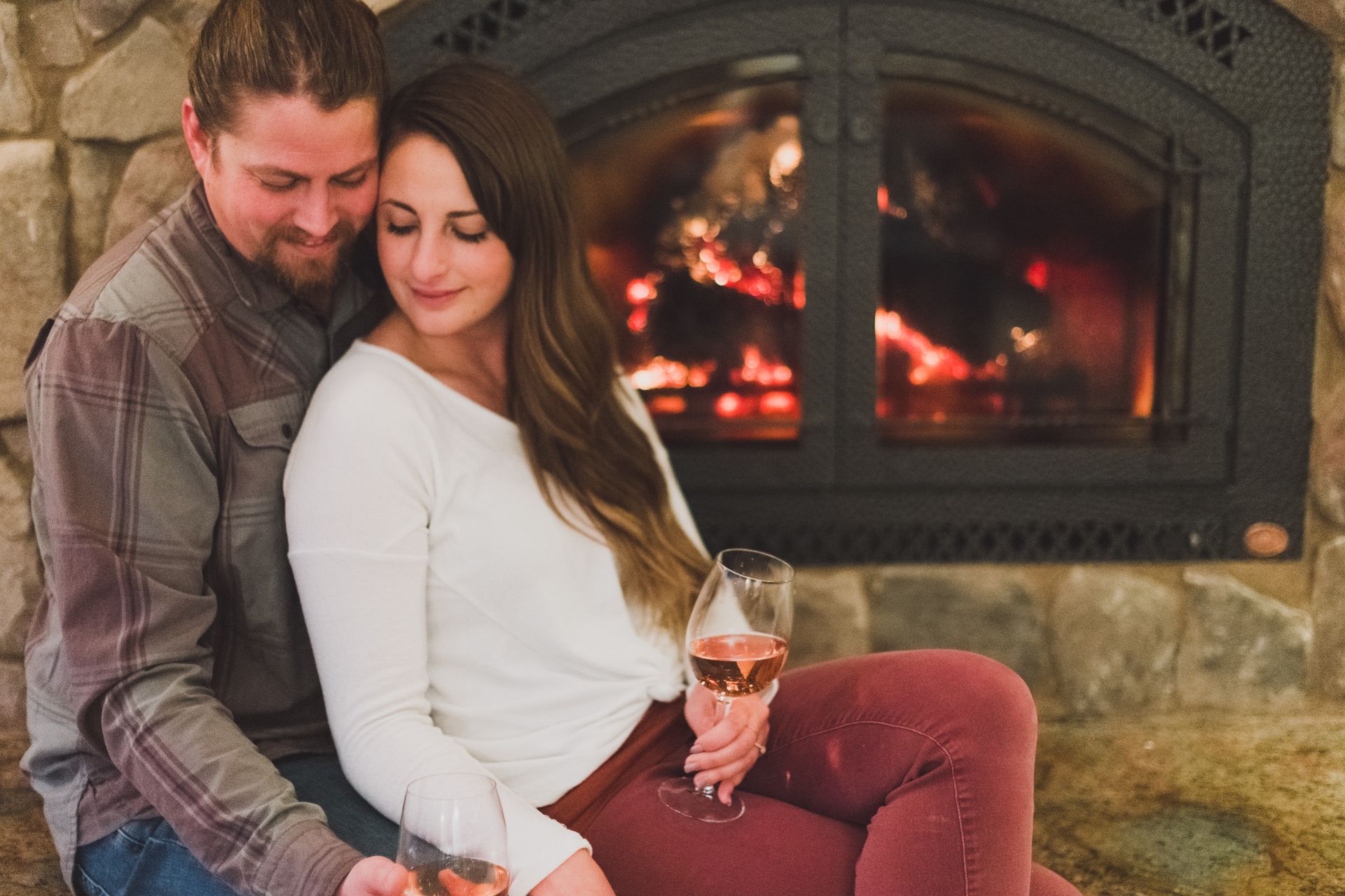 couple sipping out of one tiki drink with two straws to represent the best fall date night ideas in Bend, Sunriver, and Redmond