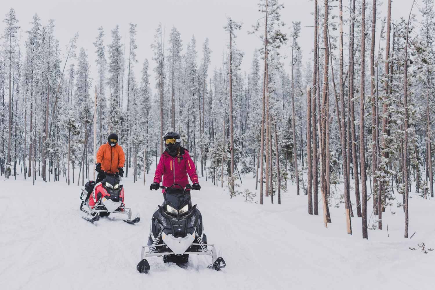 couple snowmobiling during a romantic winter getaway in Central Oregon