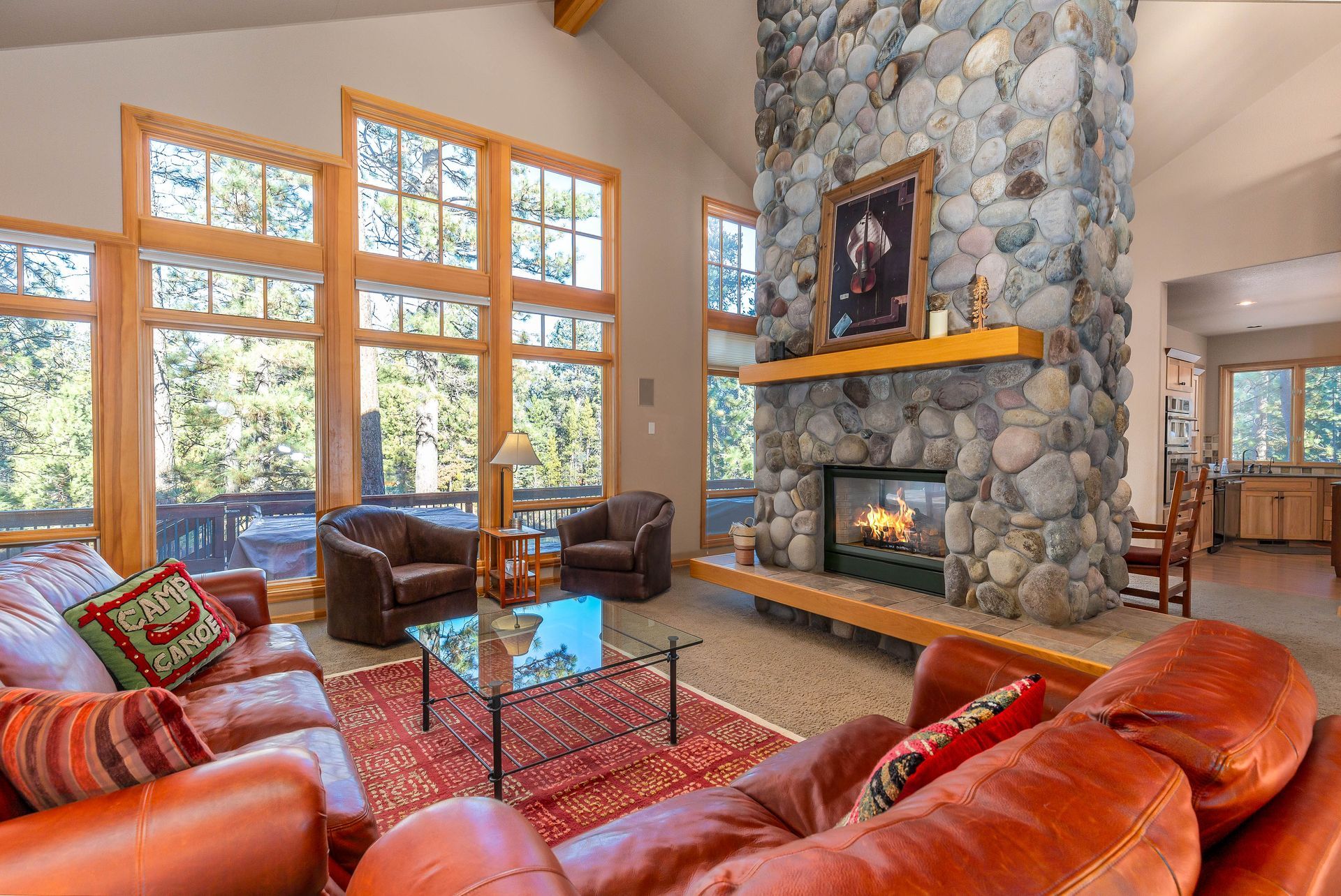 living room with stone fireplace of a pet friendly vacation rental in sunriver