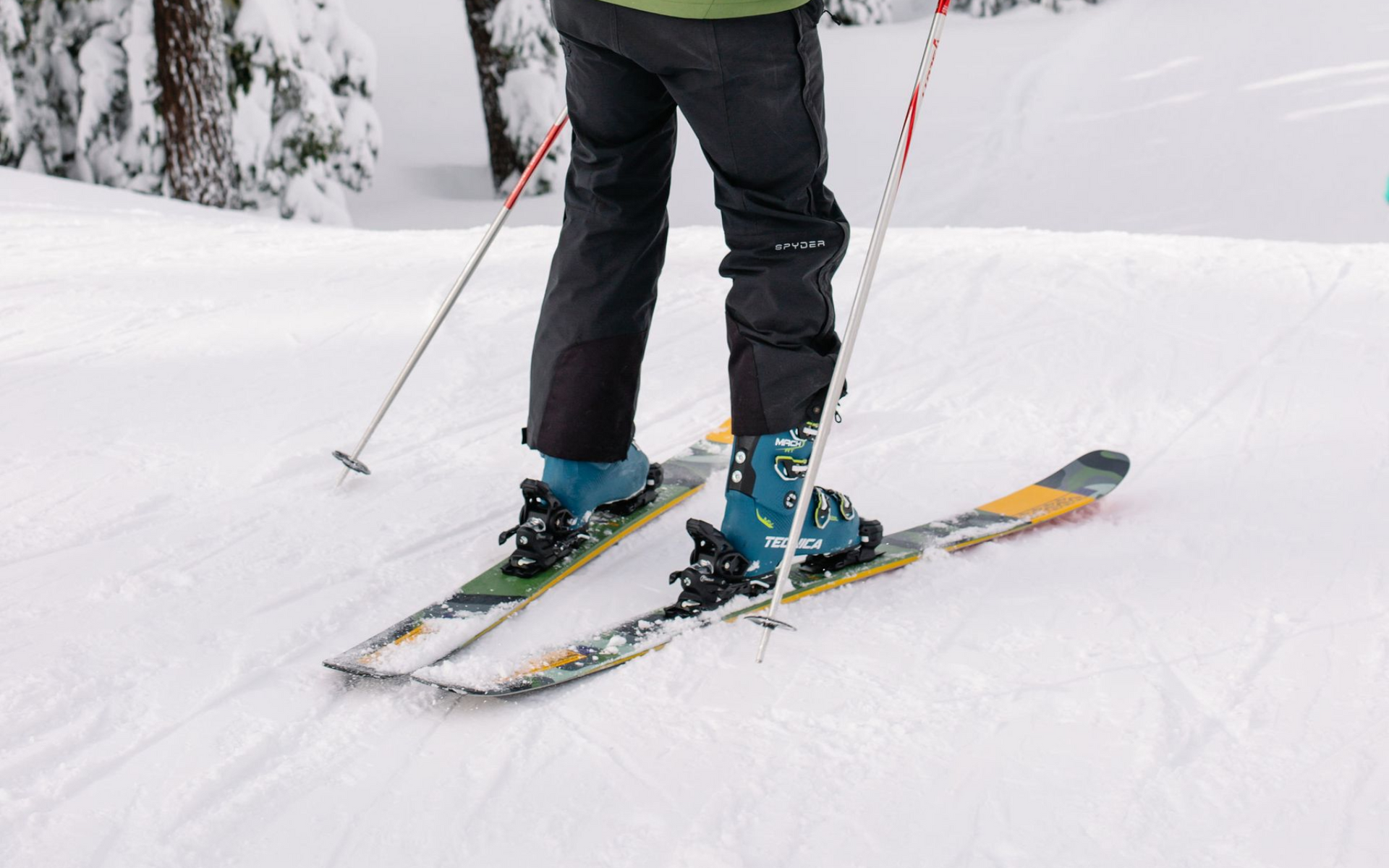 Two people snowmobiling as a winter vacation idea in Central Oregon