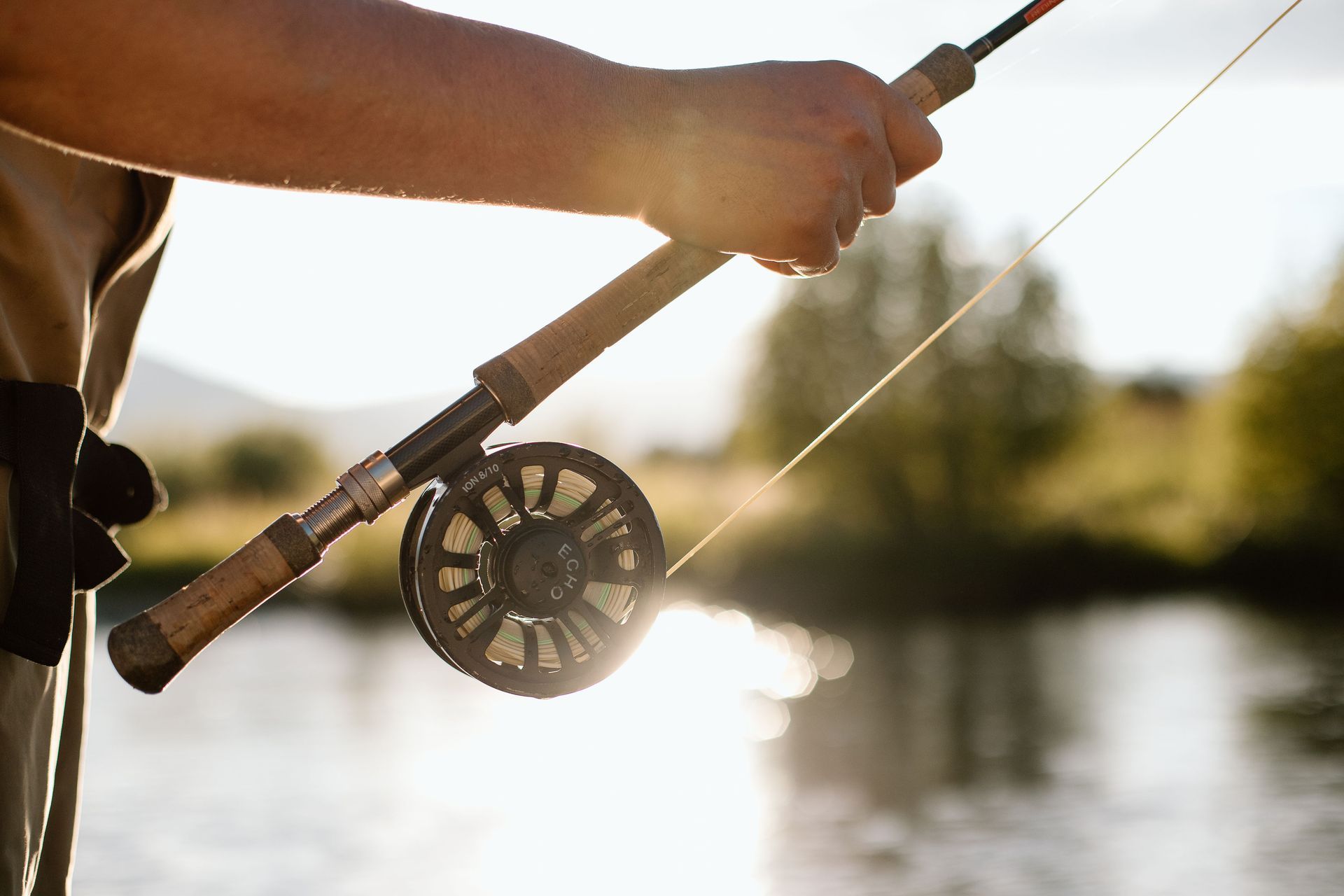 Angler with fishing rod along the Deschutes River some of the best fly fishing near Eagle Crest