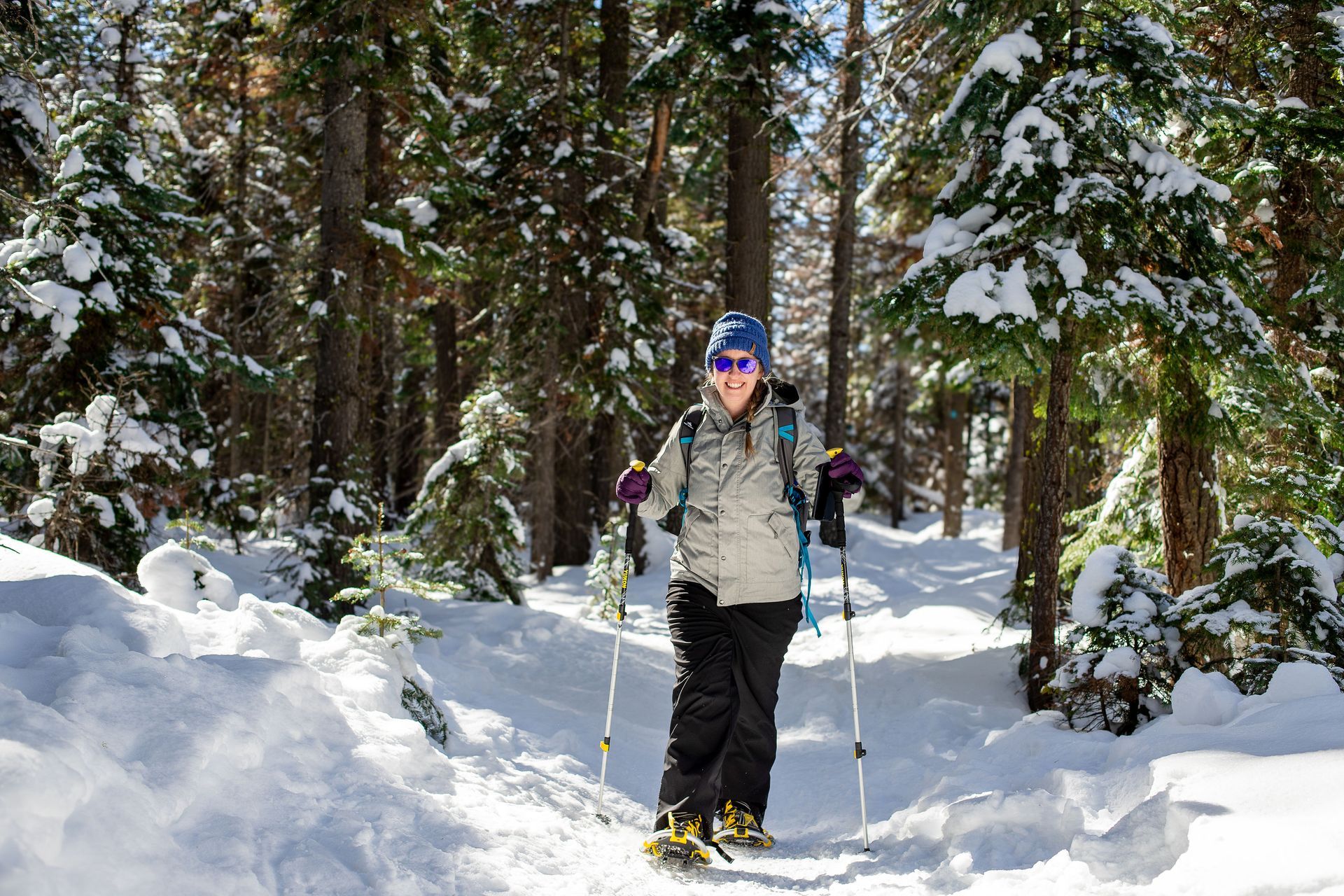 Woman cross country skiing on a forested cross country ski trail near Eagle Crest Resort