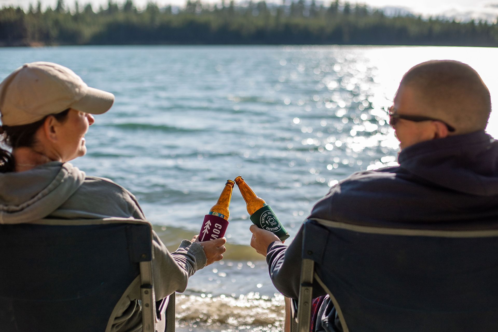 couple sipping out of one tiki drink with two straws to represent the best fall date night ideas in Bend, Sunriver, and Redmond