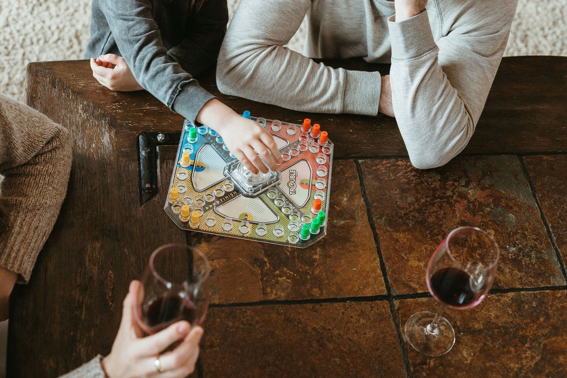 woman folding a blanket in a vacation rental in Bend