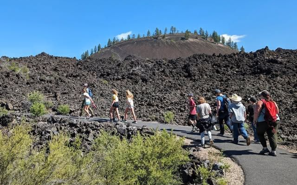 Group of people hiking at Lava Lands Visitors Center in Central Oregon