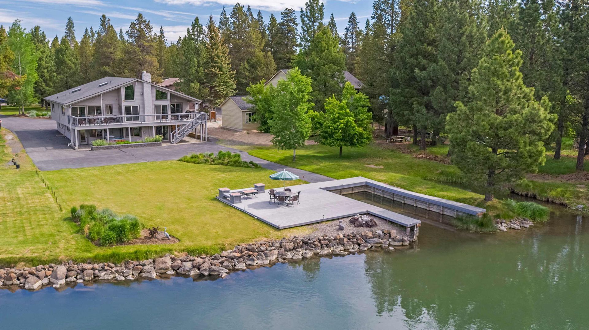 Back of Lazy River Lodge vacation rental with river access in Sunriver