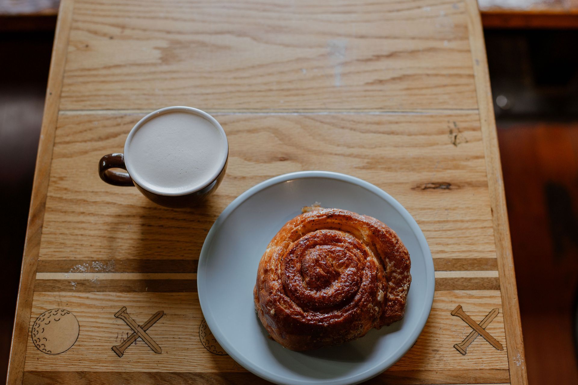 latte and sparrow ocean roll on a table at a coffee shop in Bend on Thanksgiving weekend