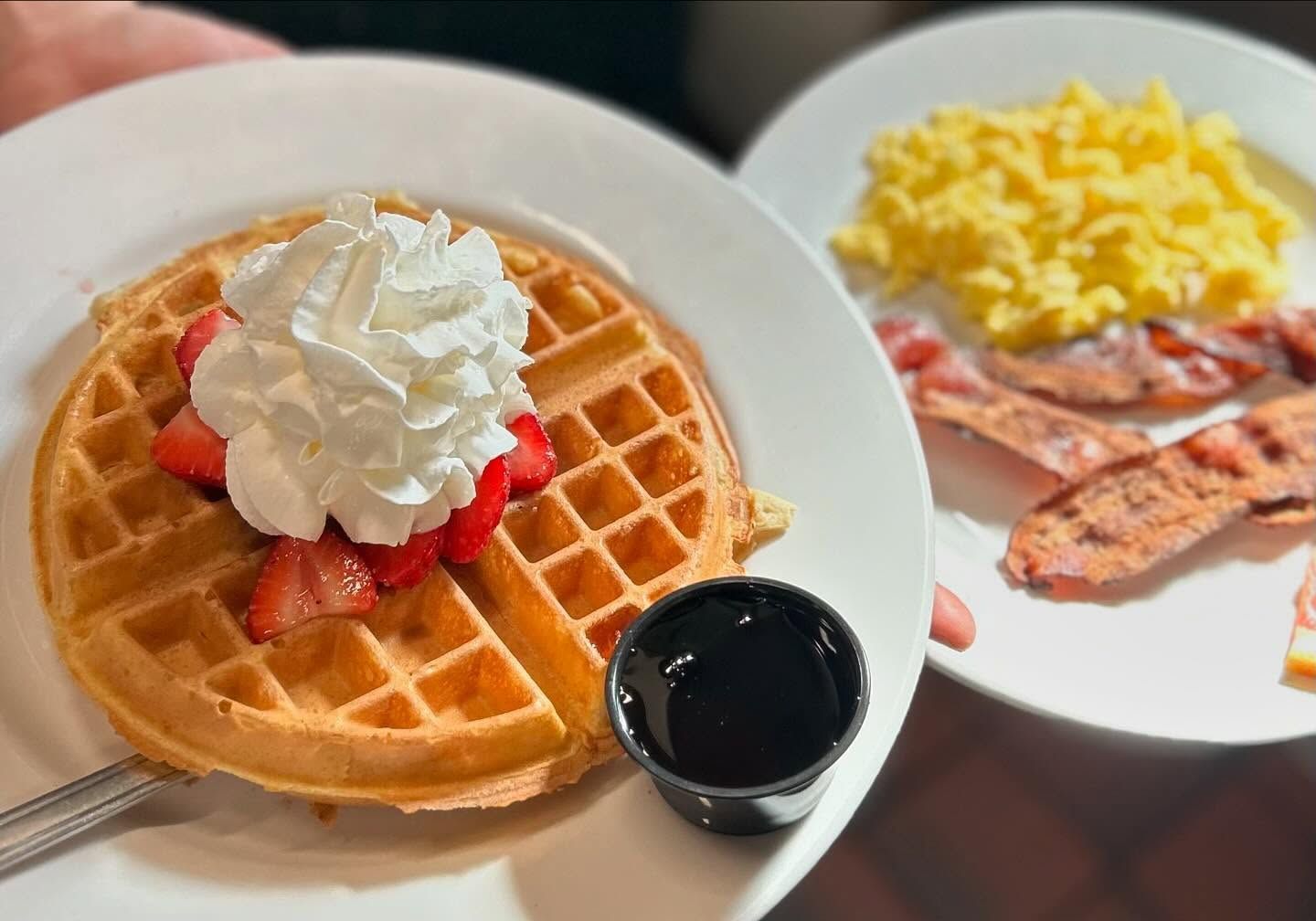 breakfast of waffles, eggs and bacon from Wallow Bar & Grill