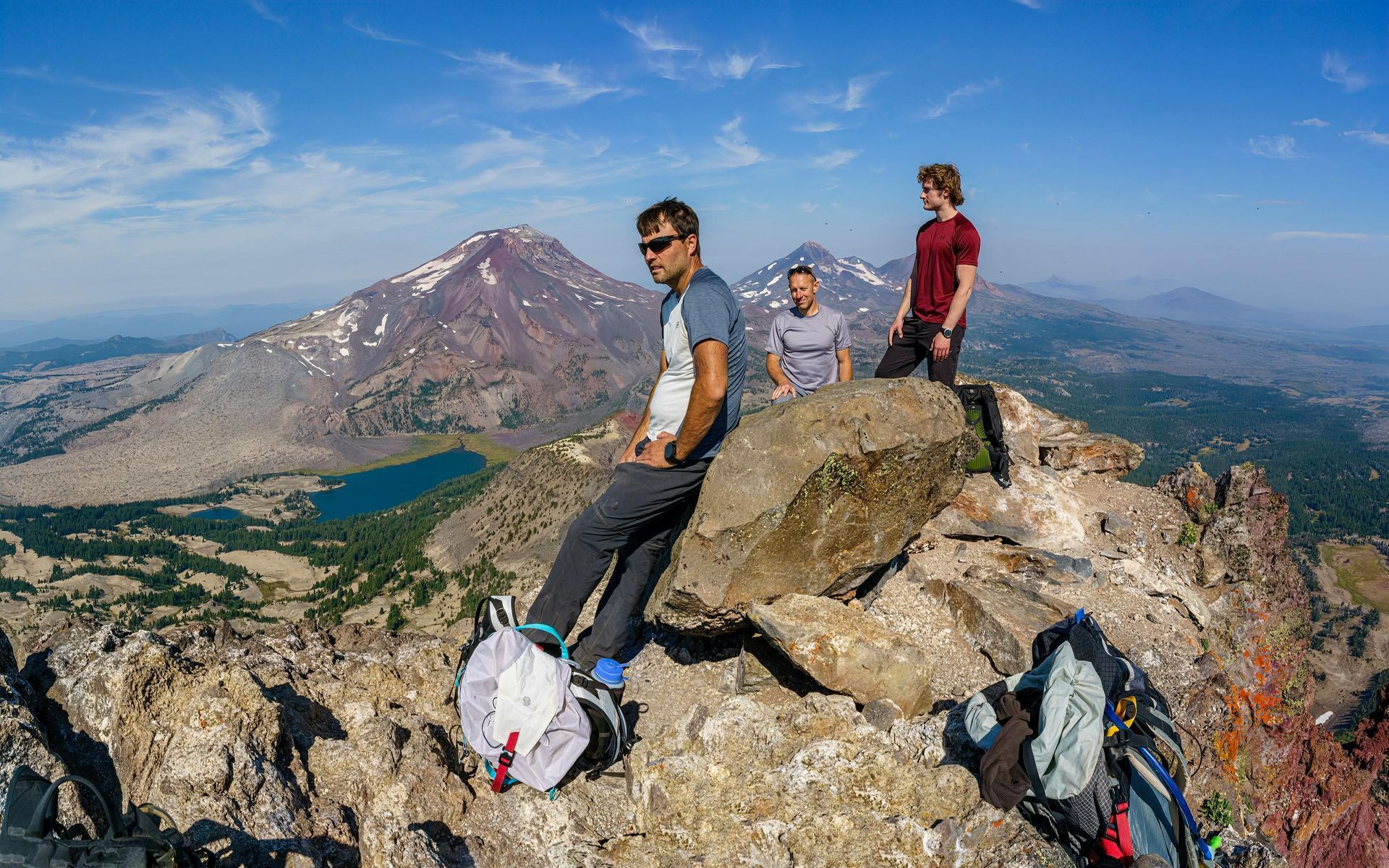 people on top of a mountain summit in Central Oregon in summer