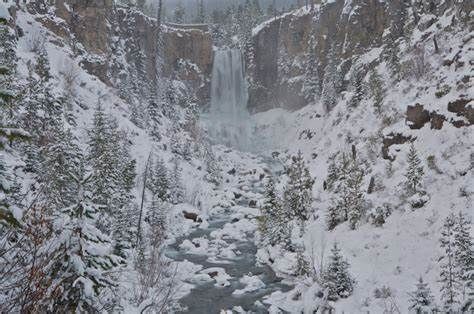Frozen and snowy view on the Tumalo Falls Trail one of the best winter hikes in Central Oregon
