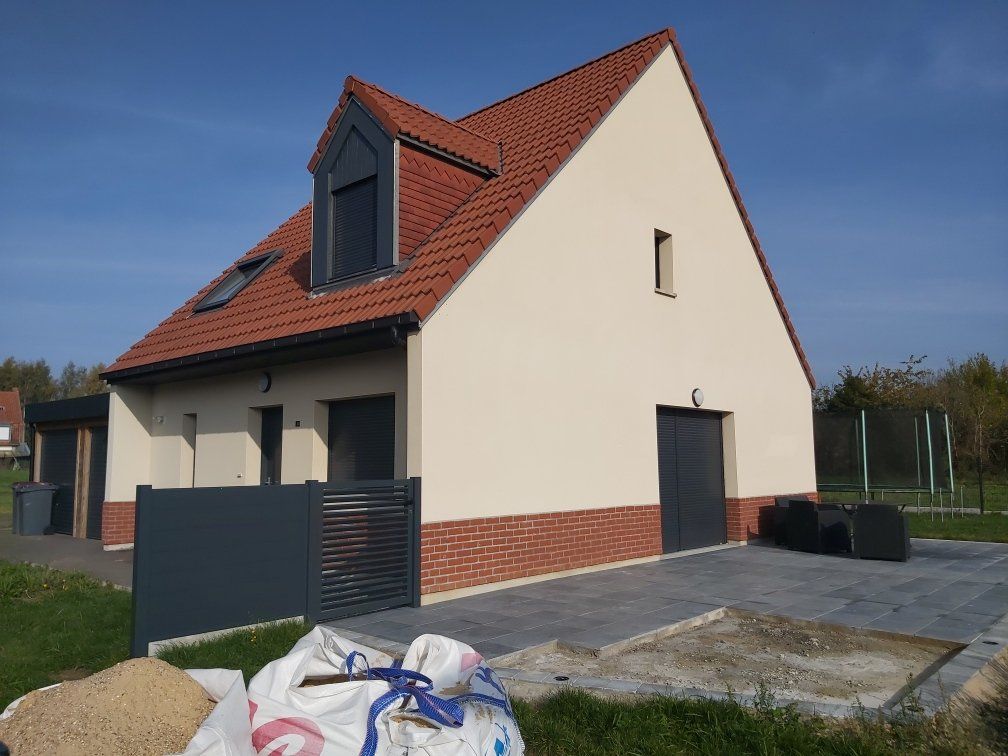 Enduit et plaquette sur maison