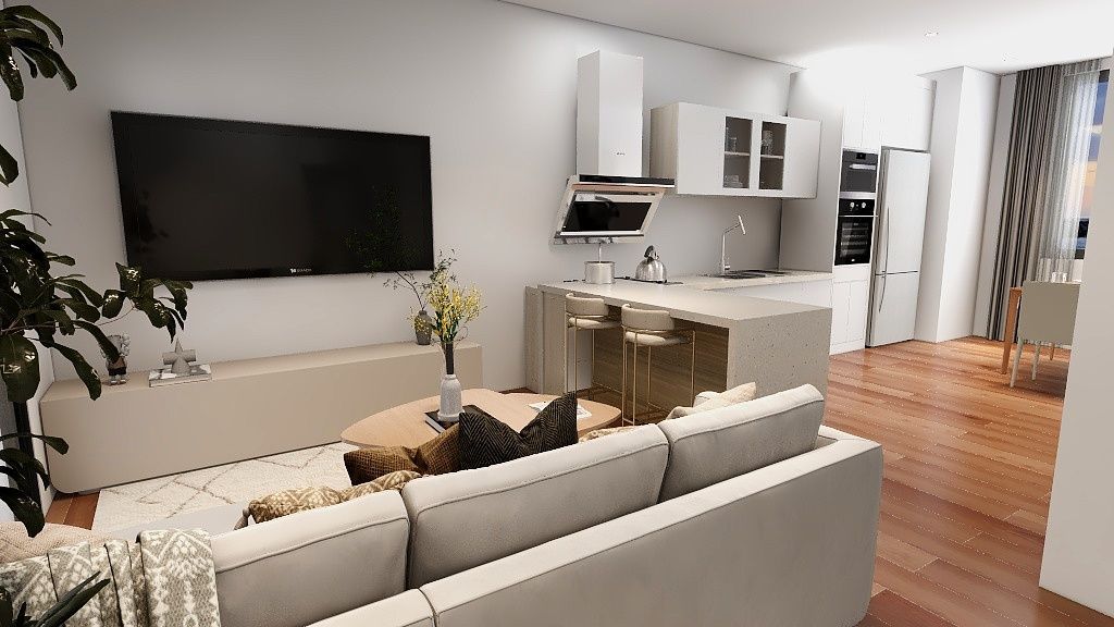 Una sala de estar con sofá, televisión y cocina.