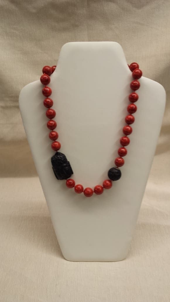 z getragen werden) Schaumkorallen-Kette mit Buddhakopf aus Onyx