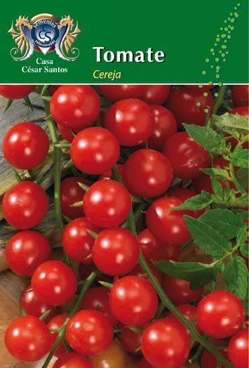 Cherry tomato plant with clusters of ripe red tomatoes and green leaves on a seed packet cover