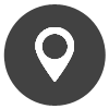 Un icono de pin blanco en un círculo negro sobre un fondo blanco.