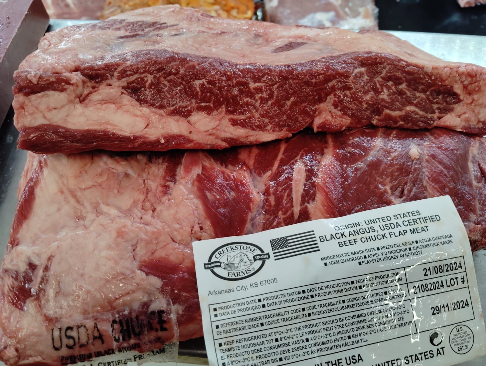 Un trozo de carne con una etiqueta que dice usda choice