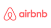 Airbnb logo: Red stylized symbol and wordmark.