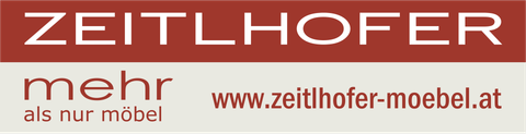 Ein rot-weißes Schild mit der Aufschrift „Zeitlhofer“