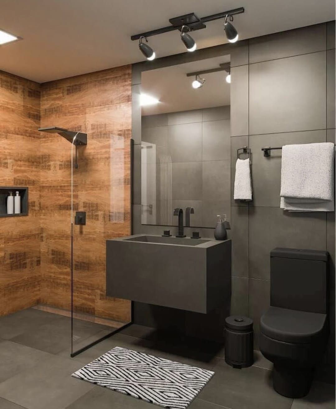 Baño moderno con azulejos gris oscuro y efecto madera. Incluye lavabo suspendido, inodoro negro e iluminación de riel.