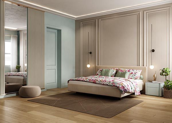 In der Mitte des Zimmers steht ein großes Bett.