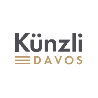 Künzli Davos Logo in Dunkelgrau und Gold auf weissem Hintergrund