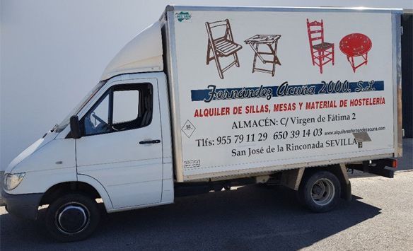 A white truck with a sign that says ' alquiler de sillas mesas y material de hosteleria ' on it