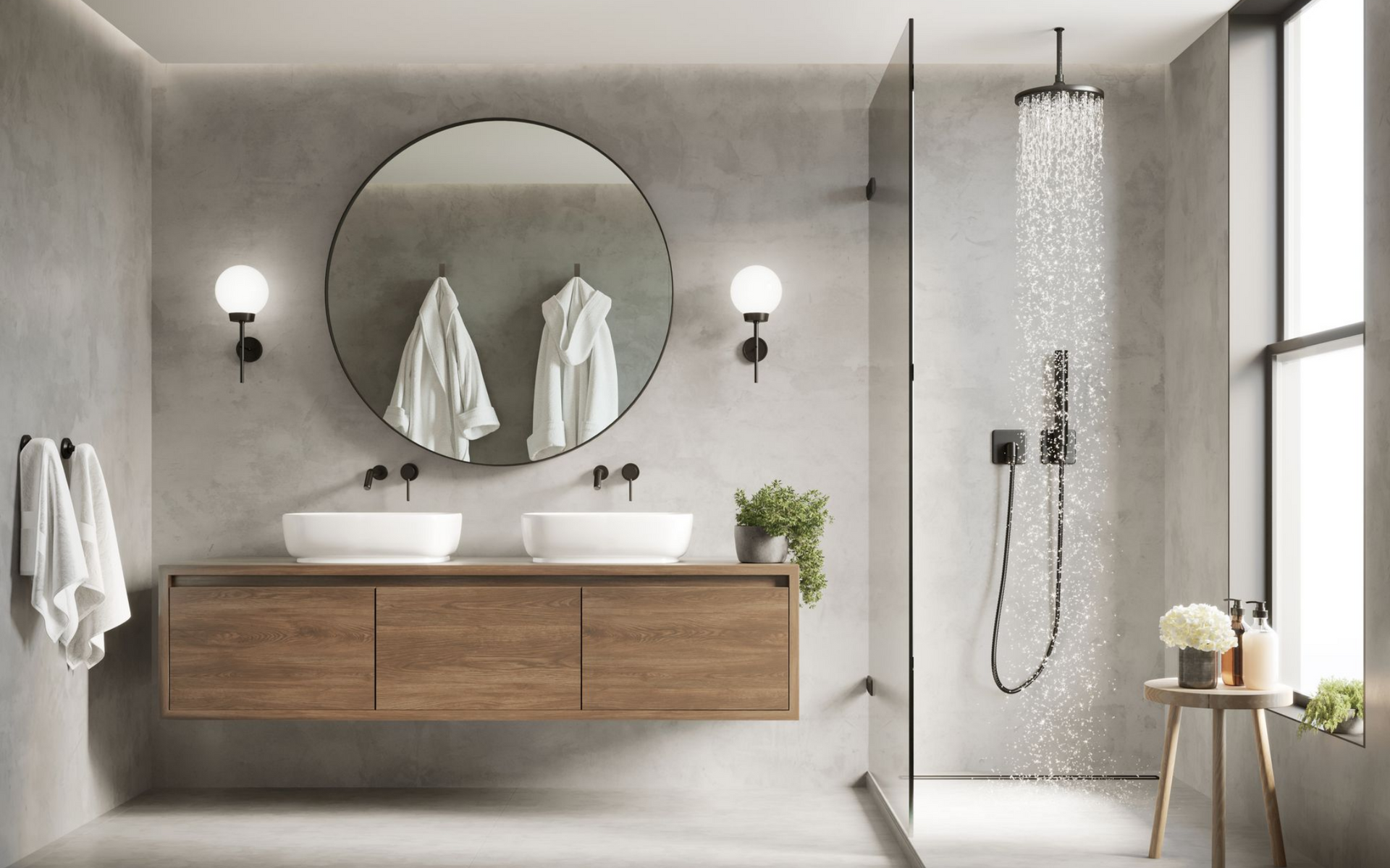 Salle de bains moderne avec murs en béton, meuble-lavabo en bois, miroir rond et robinetterie noire.