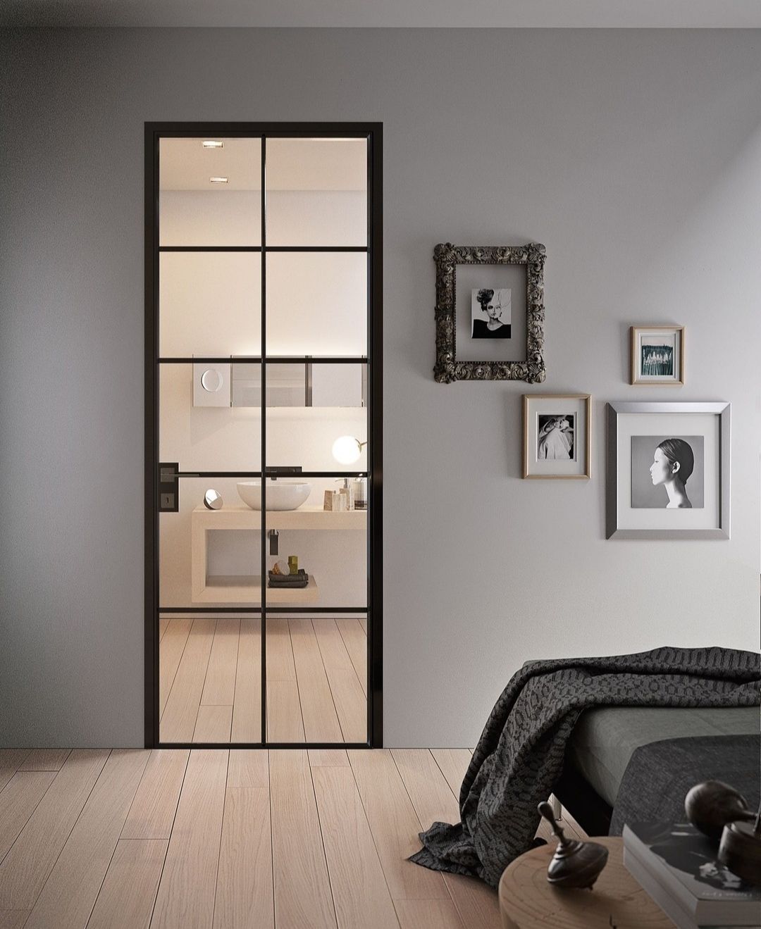 Porte vitrée à cadre noir donne sur une salle de bains.