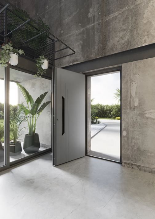 Porte d'entrée noire de style contemporain avec de légers motifs apparents