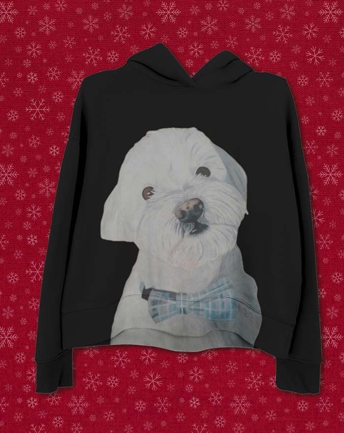 Una sudadera con capucha negra con la imagen de un perro blanco con una pajarita.
