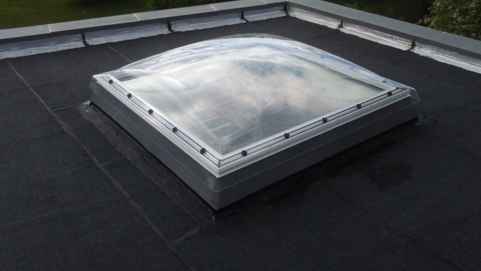 Agrandissement avec un toit plat et Velux coupole