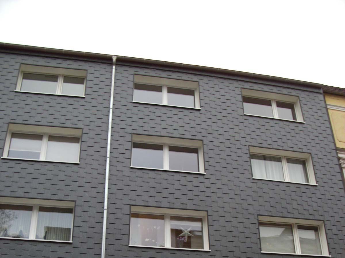 Fassadenverkleidung Mehrfamilienhaus